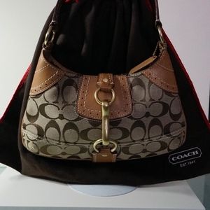 Shoulder bag with large gold buckle